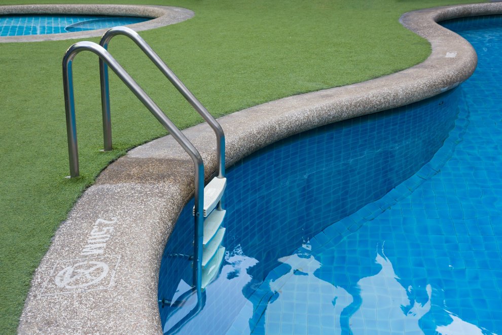 Arificial turf around swimming pool.jpeg